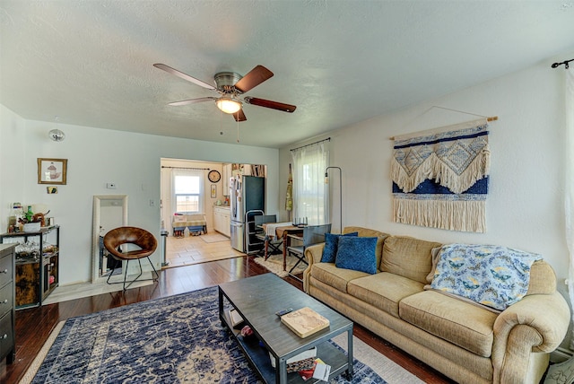 1202 Walnut St, Helena, MT 59601 - living area with a ceiling fan, wood-type flooring, and a textured ceiling