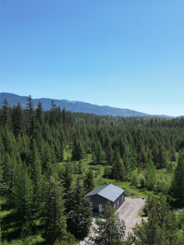 111 Lupfer Loop Rd, Olney, MT 59927 - drone / aerial view of a forest and a mountain backdrop