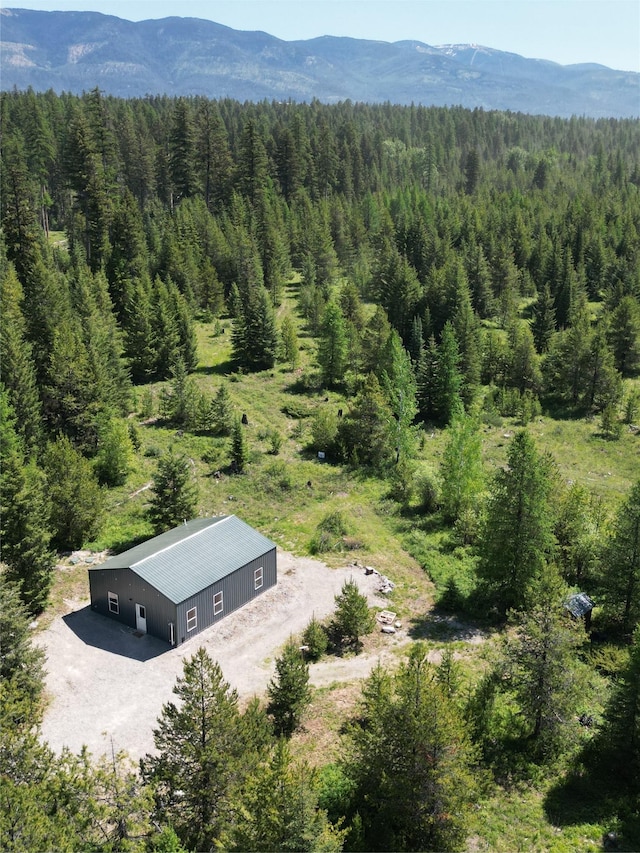 111 Lupfer Loop Rd, Olney, MT 59927 - view of subject property featuring a forest and a mountainous background