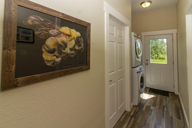 111 Lupfer Loop Rd, Olney, MT 59927 - laundry room with stacked washer / drying machine and dark wood finished floors