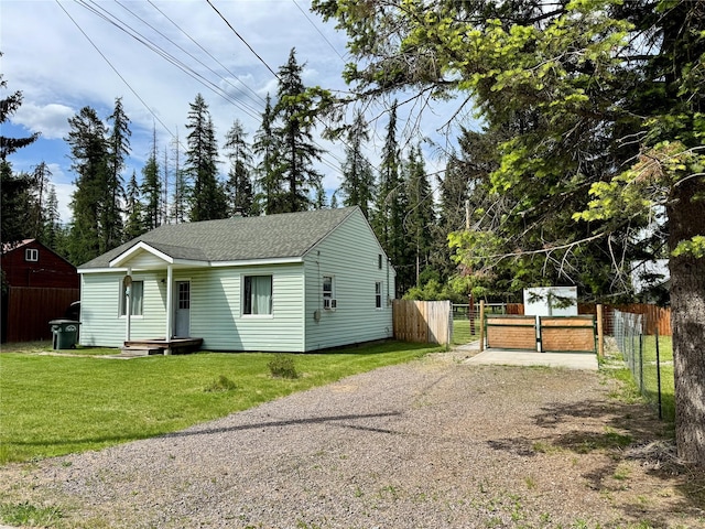 172 Garden Rd, Libby, MT 59923 - view of front facade featuring dirt driveway, roof with shingles, and a gate
