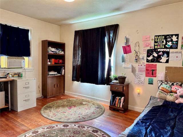 172 Garden Rd, Libby, MT 59923 - bedroom featuring light wood-style flooring and cooling unit