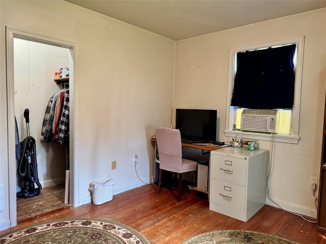 172 Garden Rd, Libby, MT 59923 - home office with wood finished floors, cooling unit, and baseboards