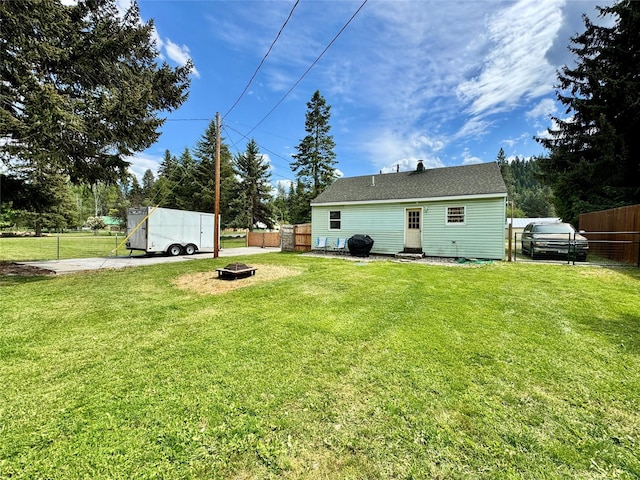 172 Garden Rd, Libby, MT 59923 - rear view of property with a fire pit and entry steps
