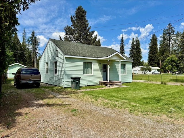 172 Garden Rd, Libby, MT 59923 - bungalow-style home with dirt driveway and a shingled roof