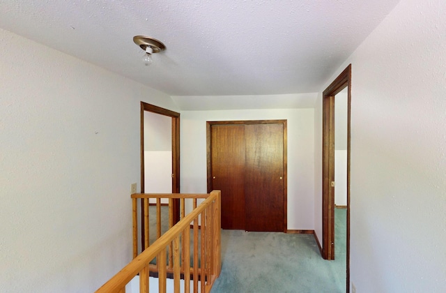906 11th St E, Polson, MT 59860 - corridor with an upstairs landing and light carpet