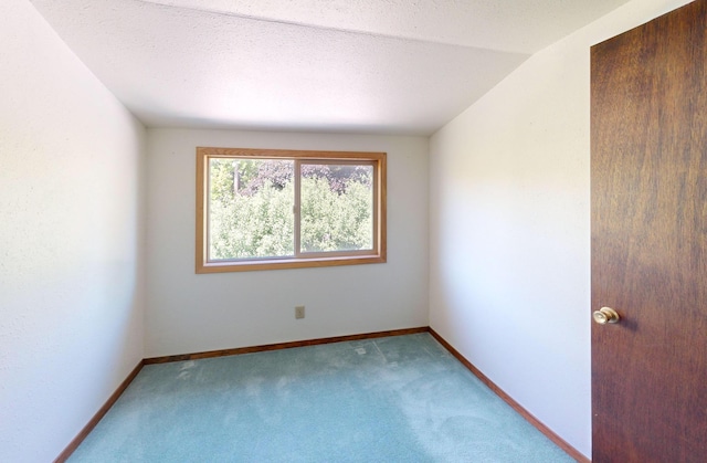 906 11th St E, Polson, MT 59860 - spare room featuring carpet flooring and baseboards