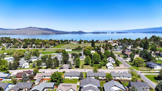 906 11th St E, Polson, MT 59860 - aerial view of residential area featuring a water and mountain view