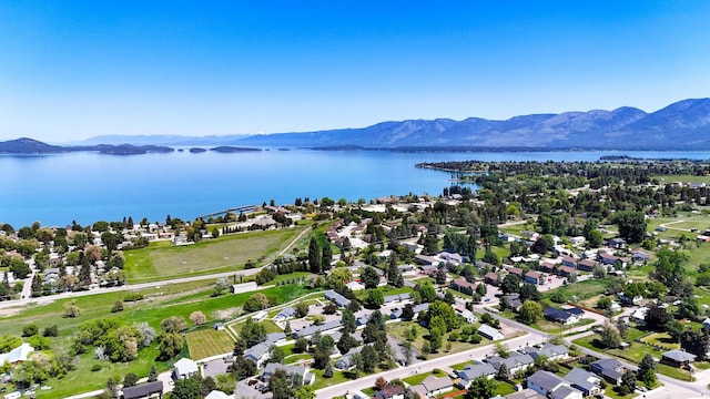 906 11th St E, Polson, MT 59860 - aerial perspective of suburban area with a water and mountain view
