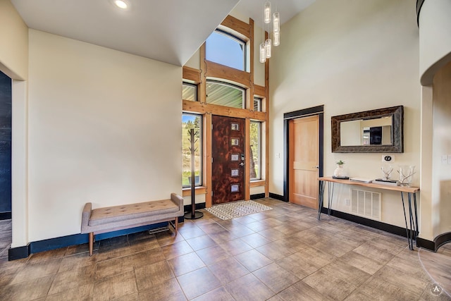 162 Jackson Creek Rd, Montana City, MT 59634 - entrance foyer with baseboards, a towering ceiling, and recessed lighting