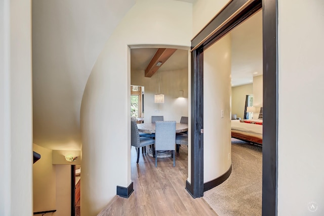 162 Jackson Creek Rd, Montana City, MT 59634 - hallway with beamed ceiling, baseboards, and light wood-style flooring