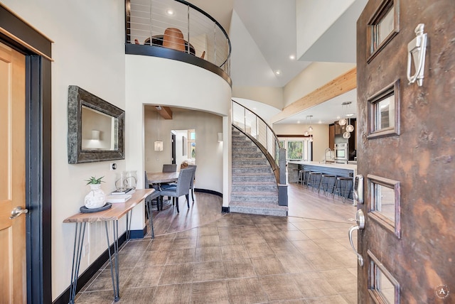 162 Jackson Creek Rd, Montana City, MT 59634 - entryway with stairway, a high ceiling, recessed lighting, and baseboards