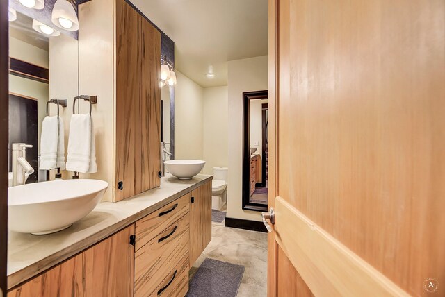 162 Jackson Creek Rd, Montana City, MT 59634 - full bathroom featuring double vanity and toilet