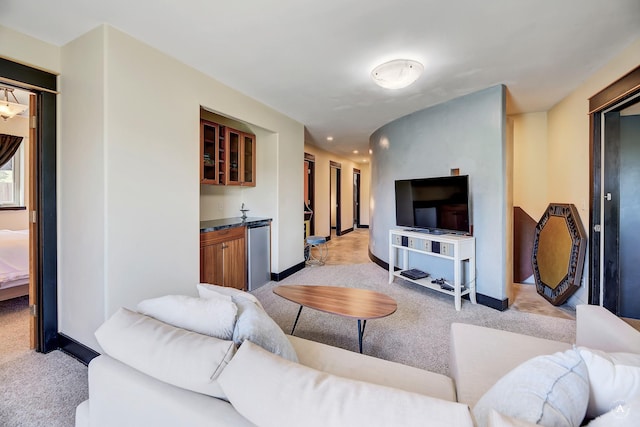 162 Jackson Creek Rd, Montana City, MT 59634 - living area with light colored carpet, baseboards, and bar