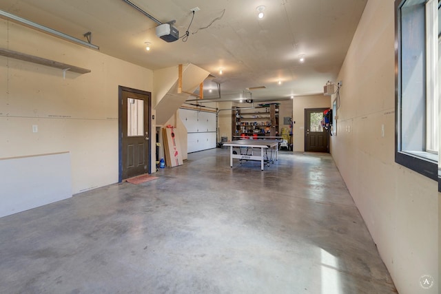 162 Jackson Creek Rd, Montana City, MT 59634 - garage with a garage door opener and a workshop area