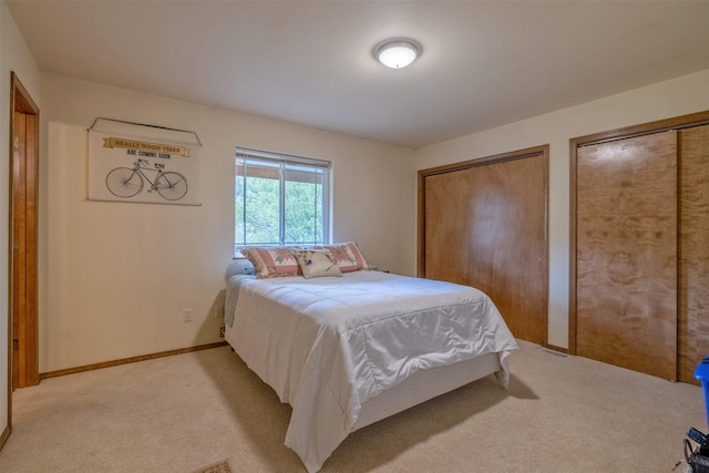 7551 York Rd, Helena, MT 59602 - bedroom featuring light colored carpet and multiple closets