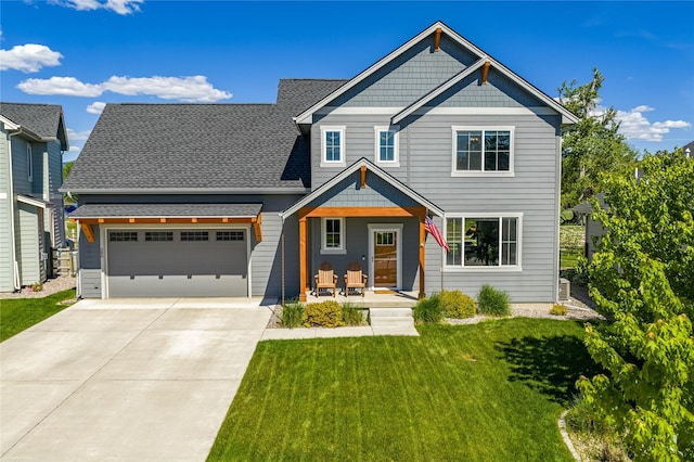 380 Stonybrook Dr, Missoula, MT 59804 - craftsman-style house featuring driveway, a front lawn, an attached garage, and a porch