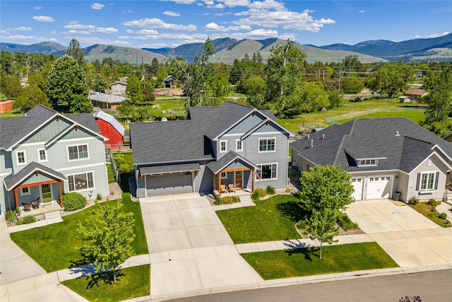 380 Stonybrook Dr, Missoula, MT 59804 - aerial perspective of suburban area featuring a mountainous background