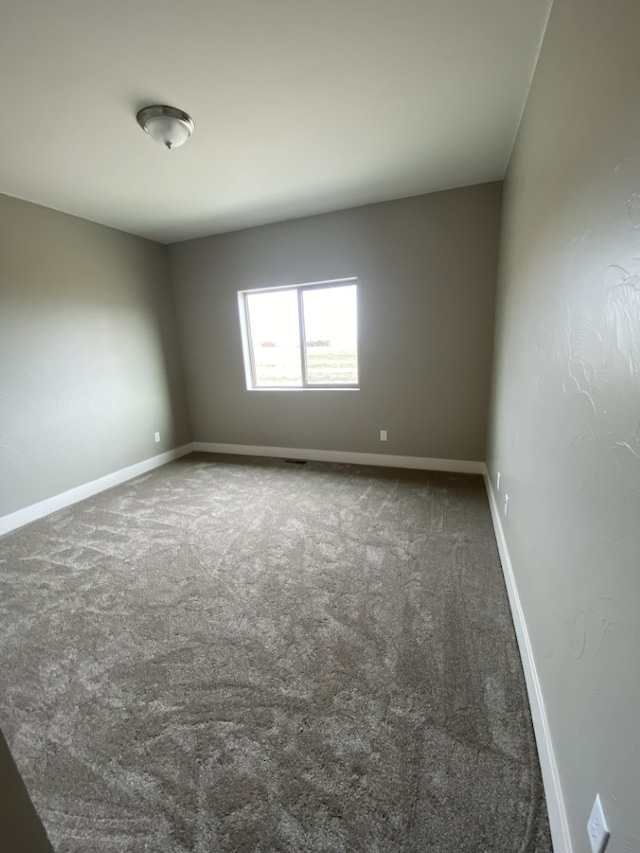3883 Lovegrass Ln, Helena, MT 59602 - carpeted empty room featuring baseboards