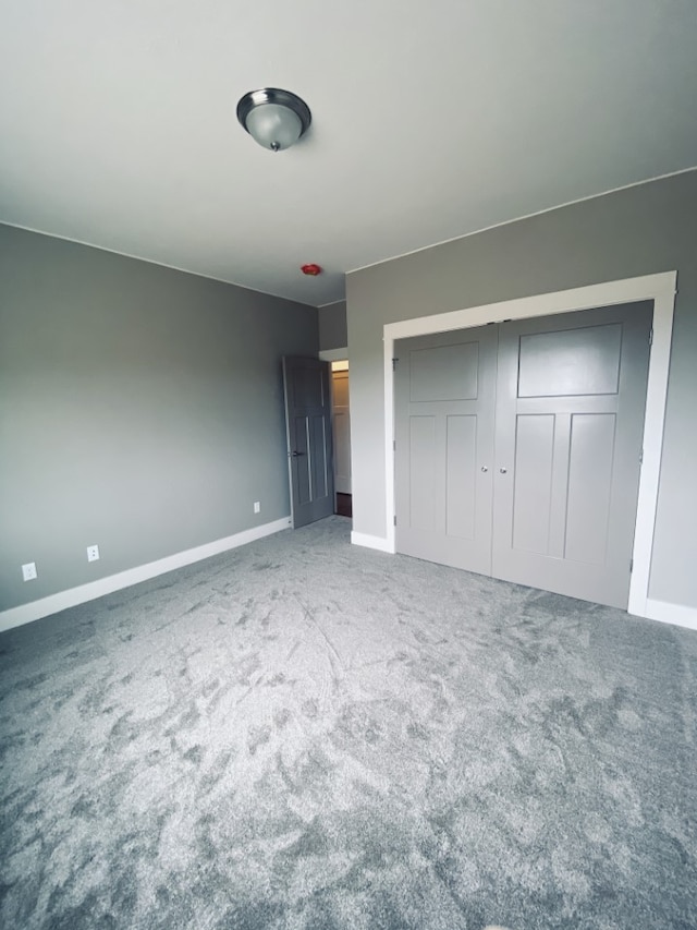 3883 Lovegrass Ln, Helena, MT 59602 - unfurnished bedroom featuring baseboards, a closet, and carpet floors