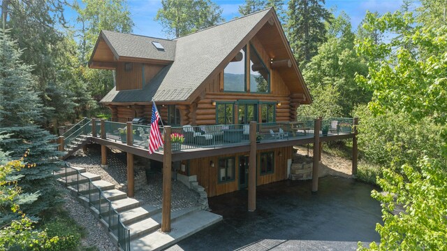 970 Colorado Ave, Whitefish, MT 59937 - rear view of property with a deck, log exterior, stairway, and roof with shingles