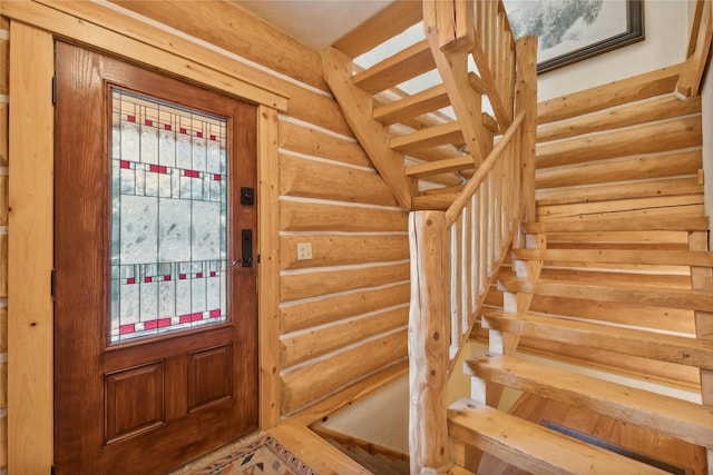 970 Colorado Ave, Whitefish, MT 59937 - entrance foyer with stairway and rustic walls