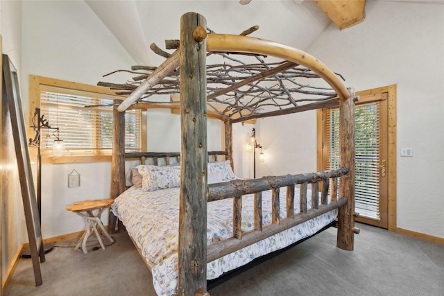 970 Colorado Ave, Whitefish, MT 59937 - bedroom featuring baseboards, carpet flooring, vaulted ceiling, and access to outside