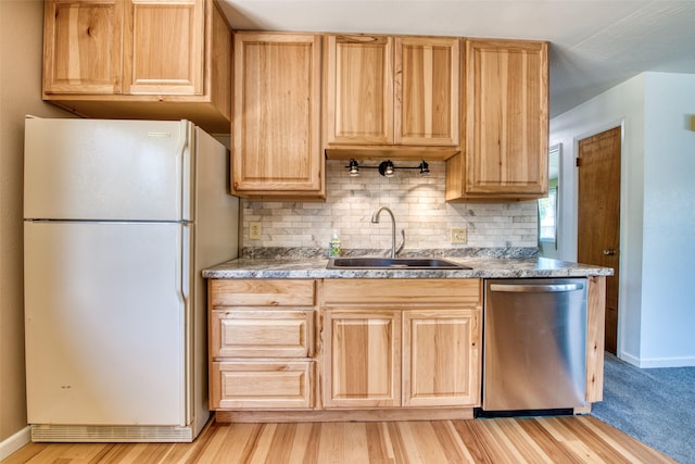 229 Glacier Dr, Lolo, MT 59847 - kitchen featuring freestanding refrigerator, dishwasher, a sink, light brown cabinetry, and tasteful backsplash
