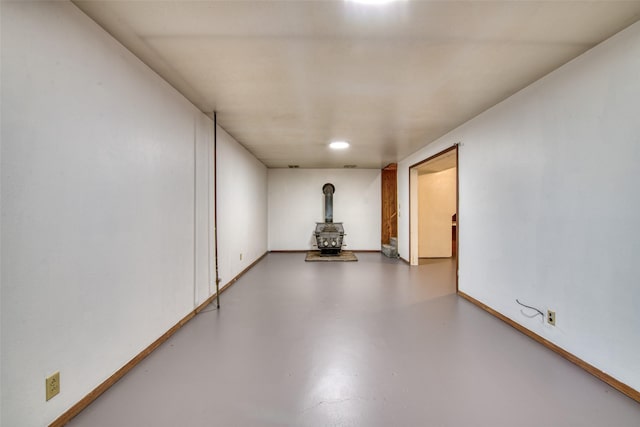 229 Glacier Dr, Lolo, MT 59847 - unfurnished room with a wood stove and finished concrete flooring