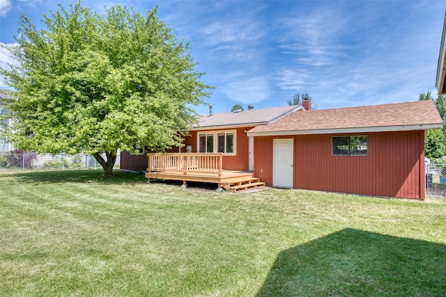 229 Glacier Dr, Lolo, MT 59847 - rear view of property featuring a wooden deck, a chimney, and a shingled roof