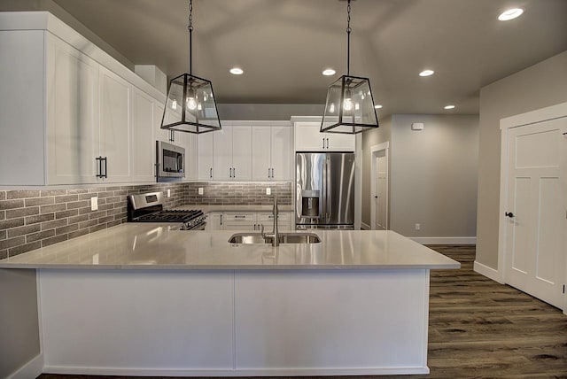 178 Meadow Vista Loop Unit A, Kalispell, MT 59901 - kitchen with appliances with stainless steel finishes, a sink, white cabinets, recessed lighting, and dark wood-type flooring