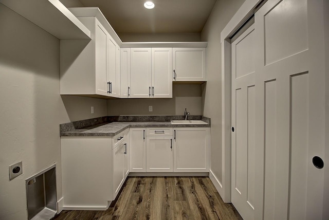 178 Meadow Vista Loop Unit A, Kalispell, MT 59901 - laundry room featuring cabinet space, dark wood finished floors, hookup for an electric dryer, and baseboards