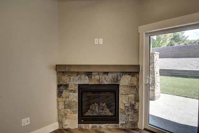 178 Meadow Vista Loop Unit A, Kalispell, MT 59901 - detailed view of wood finished floors, a fireplace, and baseboards