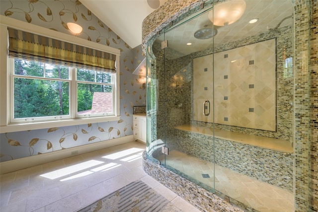 33702 N Finley Point Rd, Polson, MT 59860 - full bathroom featuring lofted ceiling, a stall shower, and vanity