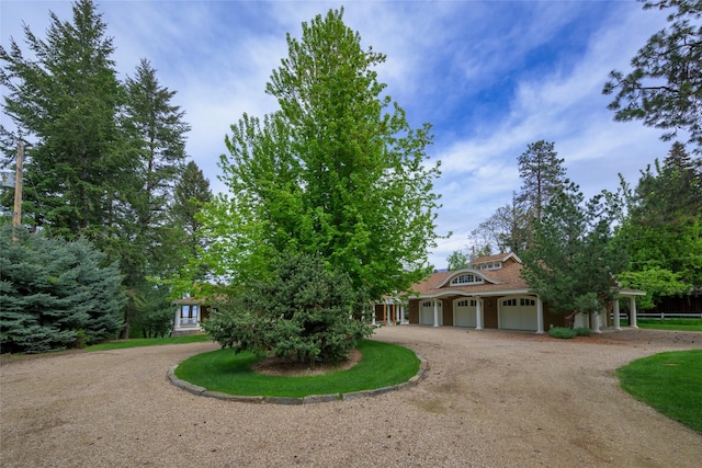 33702 N Finley Point Rd, Polson, MT 59860 - view of front of property with curved driveway and an attached garage