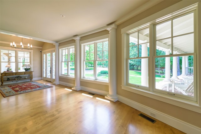 33702 N Finley Point Rd, Polson, MT 59860 - unfurnished sunroom with french doors and a chandelier