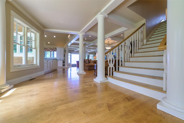 33702 N Finley Point Rd, Polson, MT 59860 - entrance foyer featuring ornate columns, stairway, wood finished floors, recessed lighting, and baseboards