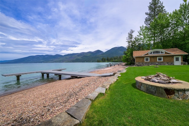 33702 N Finley Point Rd, Polson, MT 59860 - dock area with a water and mountain view and a yard