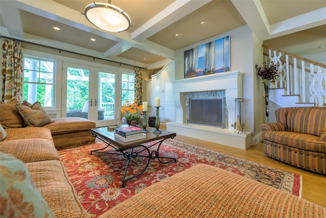 33702 N Finley Point Rd, Polson, MT 59860 - living room featuring light wood-style flooring, stairway, a fireplace, french doors, and beamed ceiling