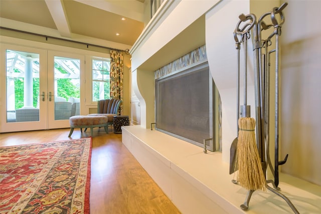 33702 N Finley Point Rd, Polson, MT 59860 - living area with french doors, wood finished floors, and beamed ceiling