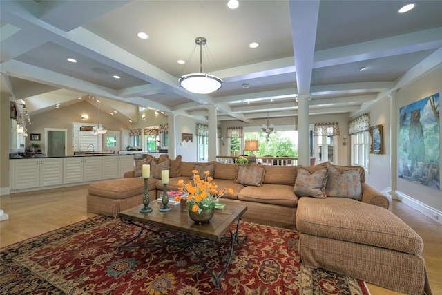 33702 N Finley Point Rd, Polson, MT 59860 - living area with ornate columns, light wood-style flooring, recessed lighting, beamed ceiling, and baseboards