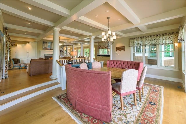 33702 N Finley Point Rd, Polson, MT 59860 - dining space with ornate columns, coffered ceiling, beamed ceiling, wood finished floors, and baseboards