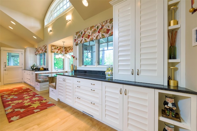 33702 N Finley Point Rd, Polson, MT 59860 - kitchen featuring plenty of natural light, white cabinetry, and light wood-type flooring