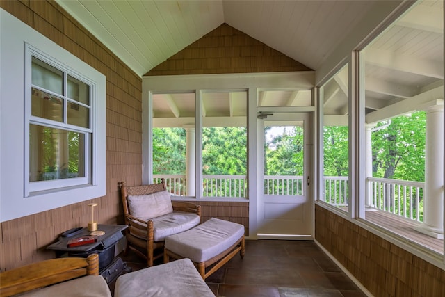 33702 N Finley Point Rd, Polson, MT 59860 - sunroom / solarium with wood walls, lofted ceiling, and stone finish flooring