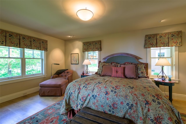 33702 N Finley Point Rd, Polson, MT 59860 - bedroom featuring baseboards and wood finished floors