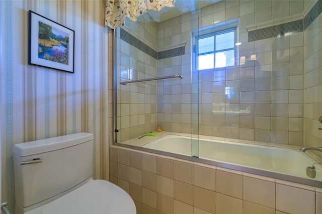 33702 N Finley Point Rd, Polson, MT 59860 - full bath with wallpapered walls, tiled shower / bath combo, and toilet