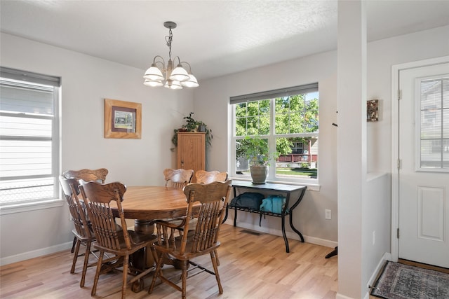 409 Bentley Park Loop, Missoula, MT 59801 - dining room with a chandelier, light wood-style flooring, and plenty of natural light