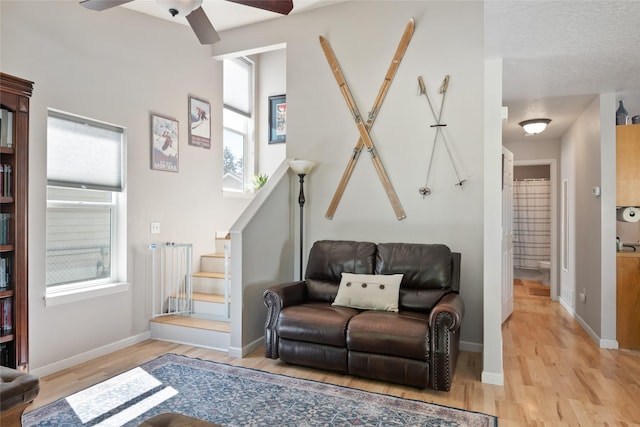 409 Bentley Park Loop, Missoula, MT 59801 - living room with light wood finished floors, a ceiling fan, and stairway
