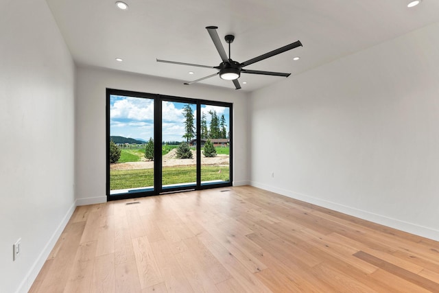 165 River Ranch Rd, Whitefish, MT 59937 - spare room featuring a ceiling fan, recessed lighting, light wood-type flooring, and baseboards