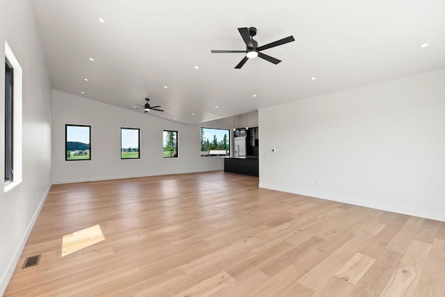 165 River Ranch Rd, Whitefish, MT 59937 - unfurnished living room featuring a ceiling fan, light wood finished floors, recessed lighting, vaulted ceiling, and baseboards